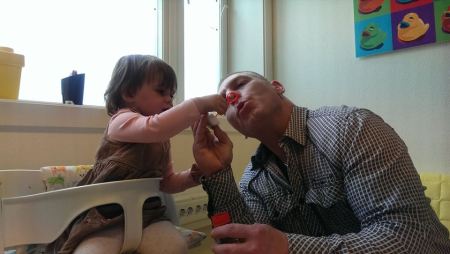 Aria holds the bubble maker for her daddy